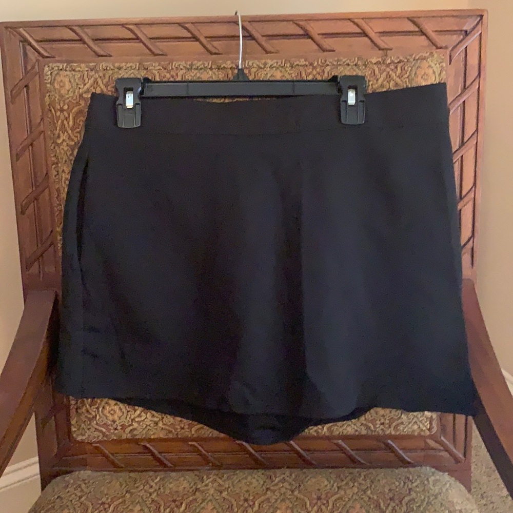 Black skort, skirt in front, shorts with pocket in back